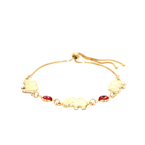 The Red Evil Eye Elephant Charm Bracelet, crafted from 14k gold-filled material, highlights three charming elephant pendants and two striking red and black evil eye motifs. It boasts an adjustable chain with a slider closure, which enhances the elegance of its simple yet sophisticated design against a white background.
